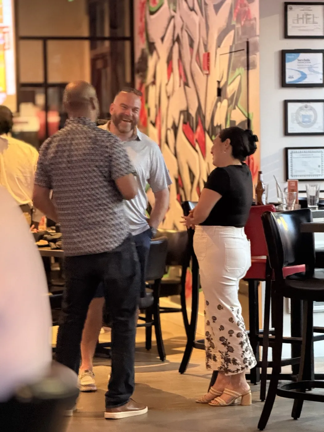 People connecting at a Revere business event.